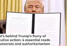 President Donald Trump shows off one of his new orders upon taking office. Anna Moneymaker/Getty Images